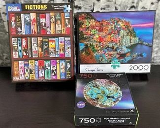 Item 213:  Lot of 3 Puzzles:  $15