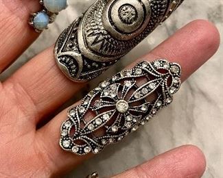 Item 246:  Assorted Funky Rings!  Small Sizes: $24 ea                                                                       a. Iridescent Stone Ring  (Index finger)                                                                  b. Geometric Circle Ring (Middle finger)                                   c. Rhinestone Center (Ring finger)                                                d. Mesh Look Ring (Pinky finger)