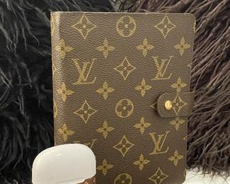 Item 296:  Louis Vuitton Agenda:  $145                                                          Item 297:  Louis Vuitton Earbuds:  $125