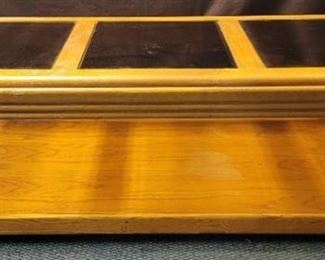 Wooden coffee table on wheels w/glass top 51" W x 23 1/2" D x 17" H