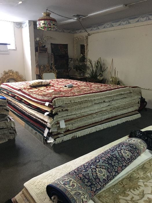 Several rooms of rugs in every size and design. Something for everyone