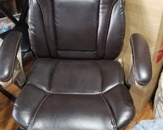 One of three leather office chairs