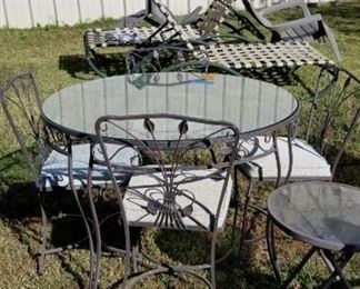 Nice metal patio table with four leaf design chairs