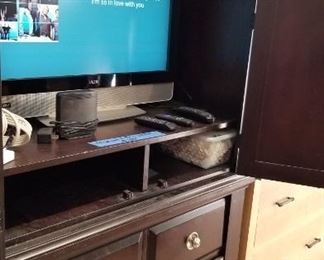 Large TV with equipment and cabinet included