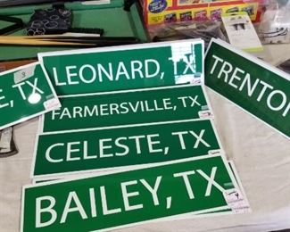 Street signs representing surrounding towns