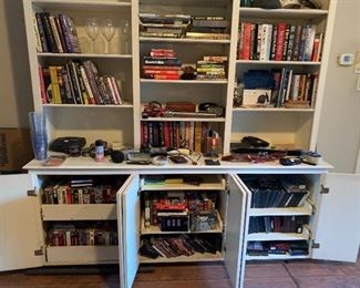 Tons of DVDs, VHS, cassette tapes, and books