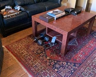 Leather couch, rug, coffee table