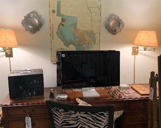 Desk, zebra chair, Match sconces, Apple computer, TV, Hotel scent diffusers (would make great Christmas gifts!)