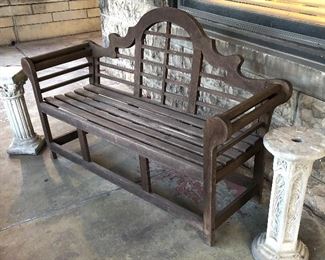 Teak bench; solid concrete plant stands.