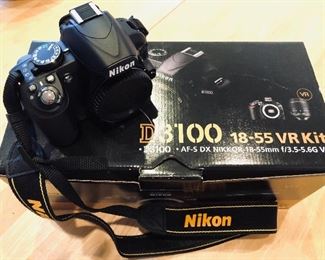 Like New Nikon D3100 18-55 VR Camera and Kit, still in box with ALL original packaging.