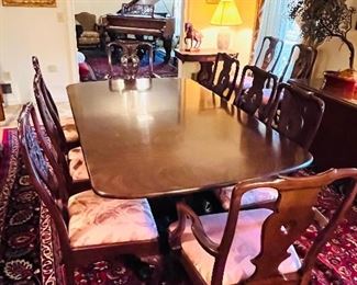 Exquisite Fine Georgian Henredon flame mahogany dining table, extends to 10’, 6’ without leaves, with 12 Georgian Henredon Asian style dining chairs with carved bird faces, 2 arm chairs and 10 side chairs . Purchased for $30,000. You won’t believe what we’re asking!
