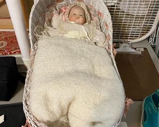 Baby doll in basket
