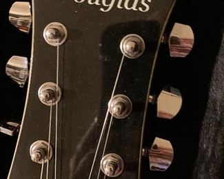 Guitars are all in one bedroom with sporting equipment