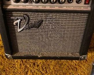 Amplifier in bedroom with all guitars