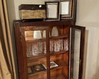 Cute depression era two door cabinet with Ralph Lauren heavy crystal glasses 