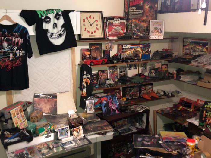 Thousands of comics and rare records and cards shirts etc.The main Pic is a focal point to get get the ball rolling  not everything in main pic will be for sale but everything on following pics will be ..Deals will be made 