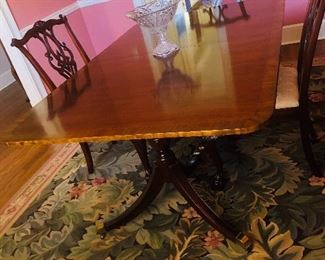 6 Carved cherry Chippendale upholstered dining chairs
Cherry double urn pedestal dining table with brass toecaps