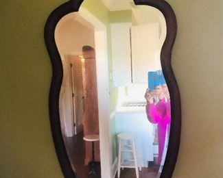 Antique mahogany scallop top mirror with decorative crest