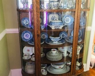 American oak and tiger oak Victorian leaded glass bow front China cabinet circa 1900