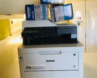 Brother color printer with several boxes of ink