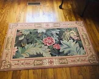Several pettipoint rugs of various sizes