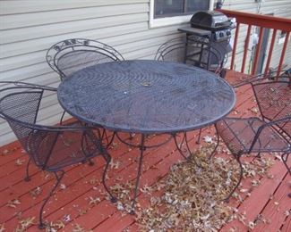 Wrought iron table w/ 4 chairs