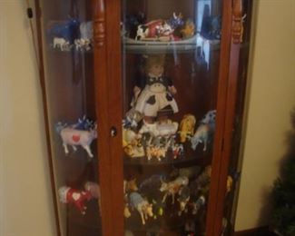 China cabinet loaded with Cowparade cows & John Deere Mary's Moo Moos