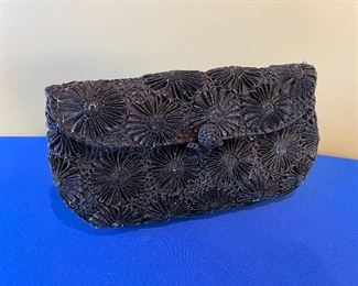 Italian made special occasion clutch. Woven ribbon flower.  $7.00