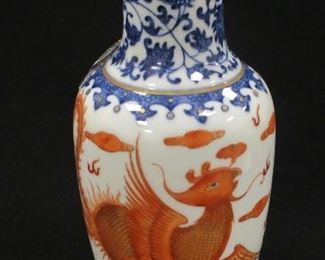 A CHINESE PORCELAIN VASE - BLUE UNDER GLAZE, COPPER RED OVER GLAZE. DEPICTS A PHOENIX FLYING AMONG CLOUDS AND FLAMES WITH A PEARL OF WISDOM. 8 7/8" TALL