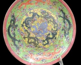 THE 'NINE FLYING DRAGONS' CHINESE PORCELAIN LOW BOWL. DEPICTS 9 IMPERIAL DRAGONS FLYING AMONGST CLOUDS, CHASING FLAMING PEARLS OF WISDOM. 9 3/8" DIAMETER
