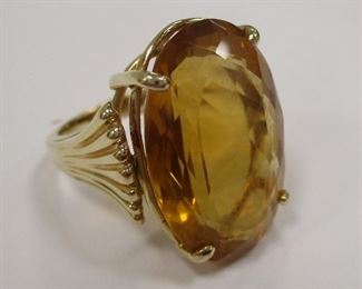 14K YELLOW GOLD RING WITH LARGE 23mm X 15mm CITRINE COLOR OVAL STONE. SIZE 7 3/4. 12 GRAMS