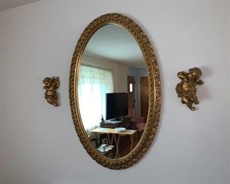 Ornate gold toned mirror, angels, cherubs