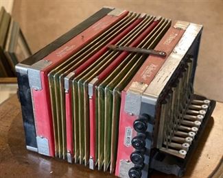 Red Hohner 1926 Philadelphia Grand Prix Diatonic Button Accordion	7x14x10in	HxWxD
