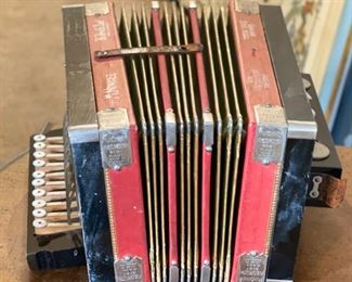 Red Hohner 1926 Philadelphia Grand Prix Diatonic Button Accordion	7x14x10in	HxWxD
