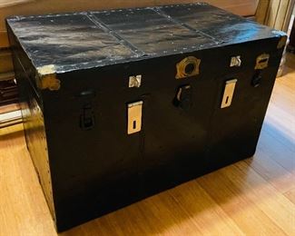 77___$75
Black travel trunk