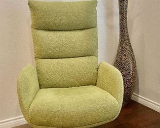 Green swivel and rocking chair. Large vase.