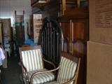 Overall view. Foreground pair of chairs with stylized dolphins.