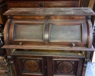 This antique roll top desk has a large hutch that sits on top