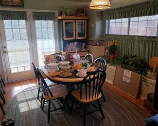 nice kitchen dining table with 6 chairs and a matching cabinet