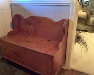Antique pine settle with storage.