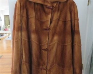 Custom hooded fur jacket with bakelite clasps