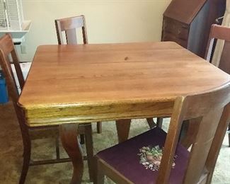 Very sturdy, solid oak table and chairs.  Also has 3 leafs