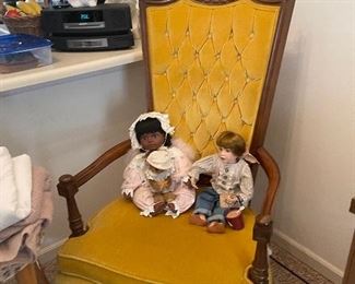 antique chair and dolls