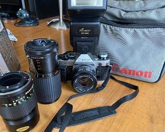 Canon AE-1 sold with bag, extra lenses and flash.