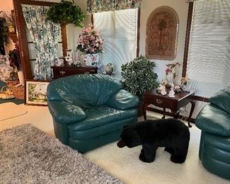 Matching green leather chair, stuffed bear