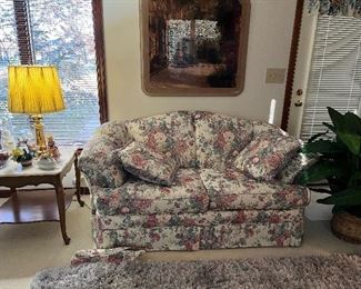 There is a pair of these matching floral loveseats. 