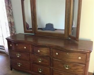 Solid wood bedroom dresser and mirror.