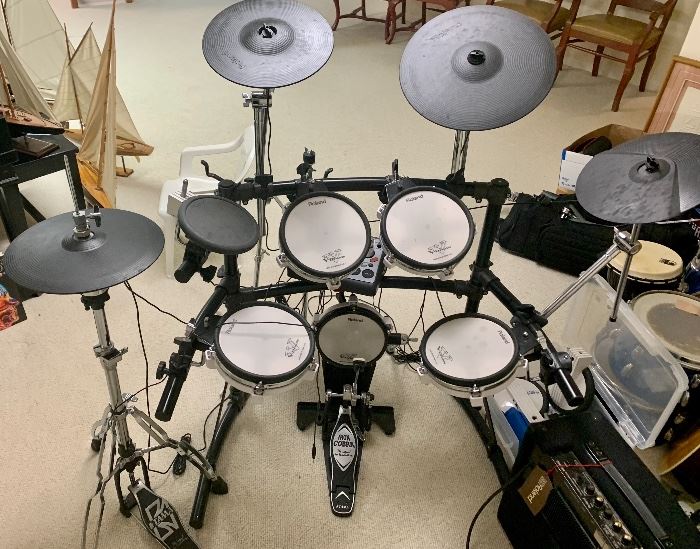 Roland V 10pc Drum kit w/ TD-8 sound machine $900
Roland KC-100 4 channel amp $200
Both $1,095