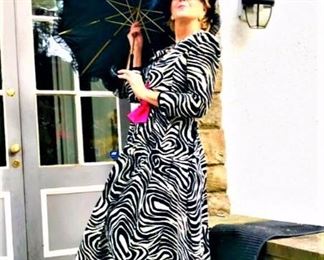 Beautifully modeled by Jewelry and Fashion Specialist Anne Longley, here in a vintage Black and White designer dress and parasol. Come see the magnificent array of specialty ladies clothing from evening wear to cruise wear she has selected from four closets full!