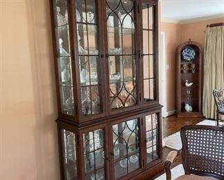 $750  EXQUISITE LIGHTED GLASS CHINA CABINET/DISPLAY WITH A TOTAL OF 4 GLASS SHELVES

 WHY WE LOVE IT:

 A star is born. Inspired by the refined glamour of days past with couture touches certain to survive the test of time. Beveled glass doors open to reveal a total of 4 glass shelves set before a full mirror back panel. Beveled glass side panels and recessed rheostat lighting create a gallery display of what lies within. Detailed crown molding in a modified dentil design finishes this lovely cabinet that can be used for many purposes. 

 DETAILS + DIMENSIONS:
Lower: 52L X 17D X 35 inches
Upper: 48L X 15D X 55H inches
 
CONDITION: This is a vintage piece that has been extremely well cared for and is in very good condition.  There may be minor superficial signs of wear to be expected with use and age. Please refer to photos for a more detailed look at condition.  We make every attempt to list and photograph any defects or signs of wear that are significant to this sale. 

 

LOCAL PICK U